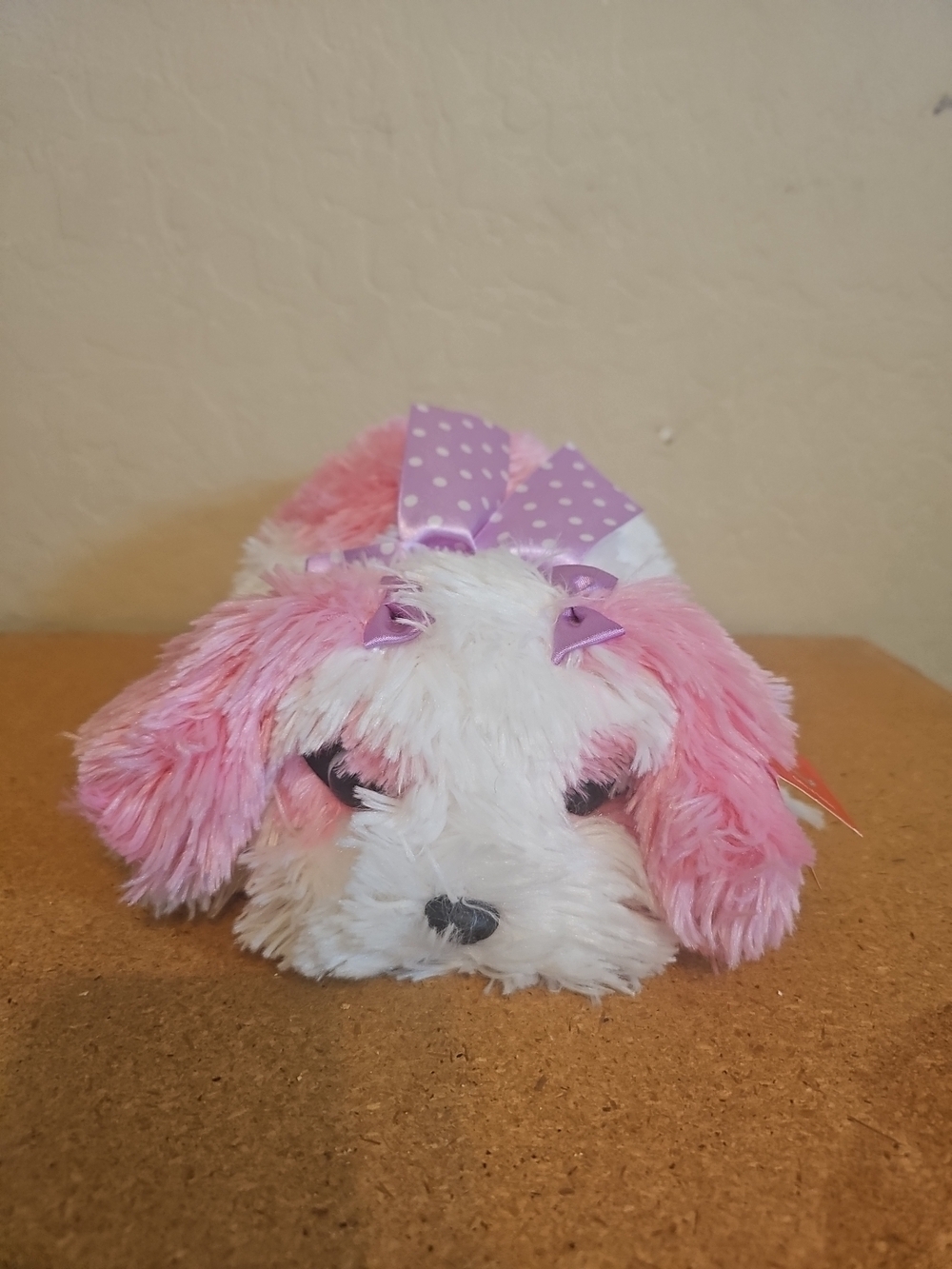 Aurora Flopsie Maddy Dog plush toy. 